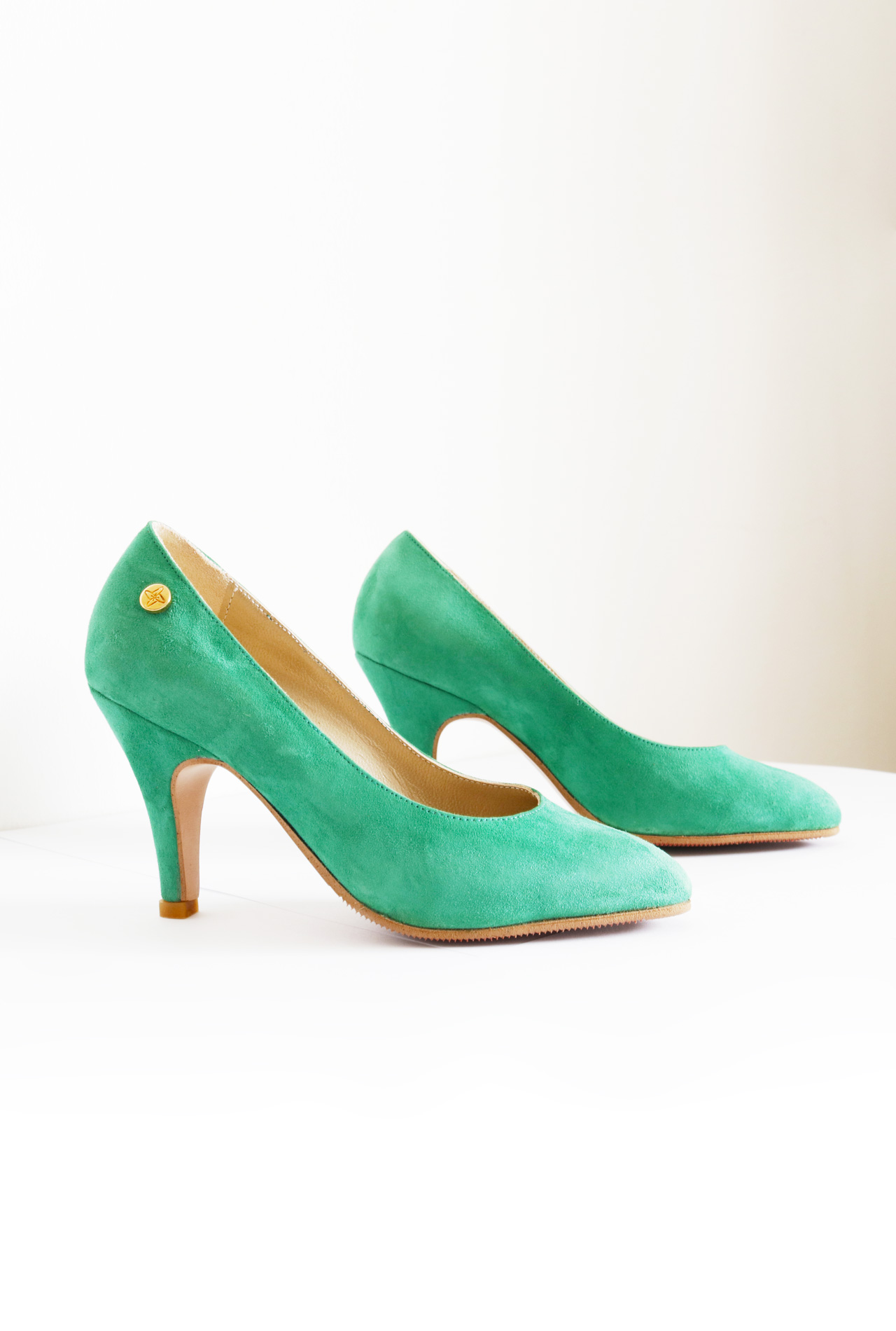 green suede court shoes